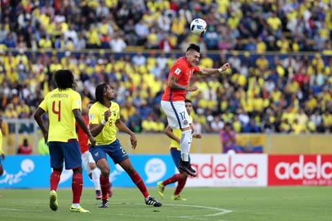 Soccer player heads ball