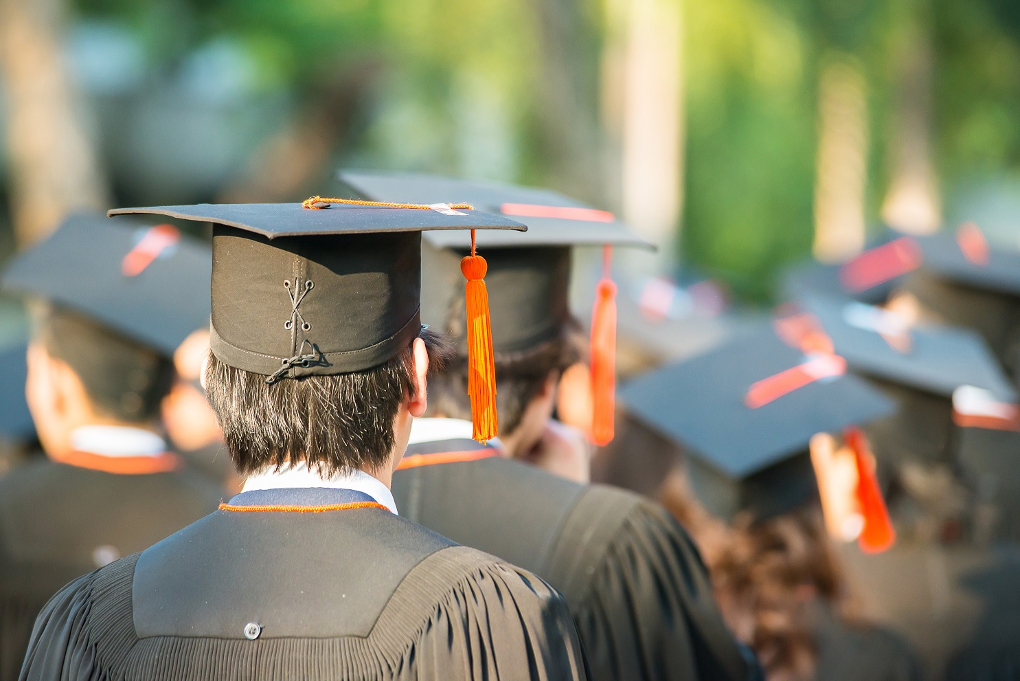 Back of heads of students at a graduation ceremony
