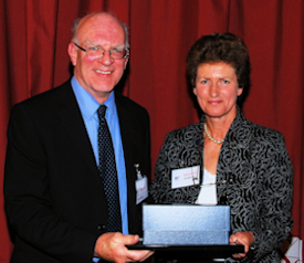 Geoff Royston being awarded Companion of OR 2008 with Sue Merchant