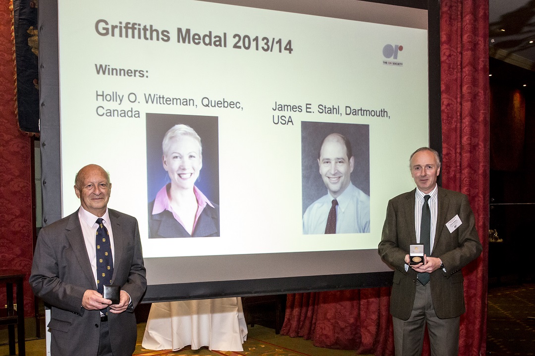 Screen showing Holly Witteman and James Stahl winners of 2013/14 Griffiths Medal with Jeff Griffiths and Stewart Robinson