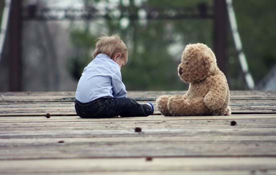 young boy with teddy bear