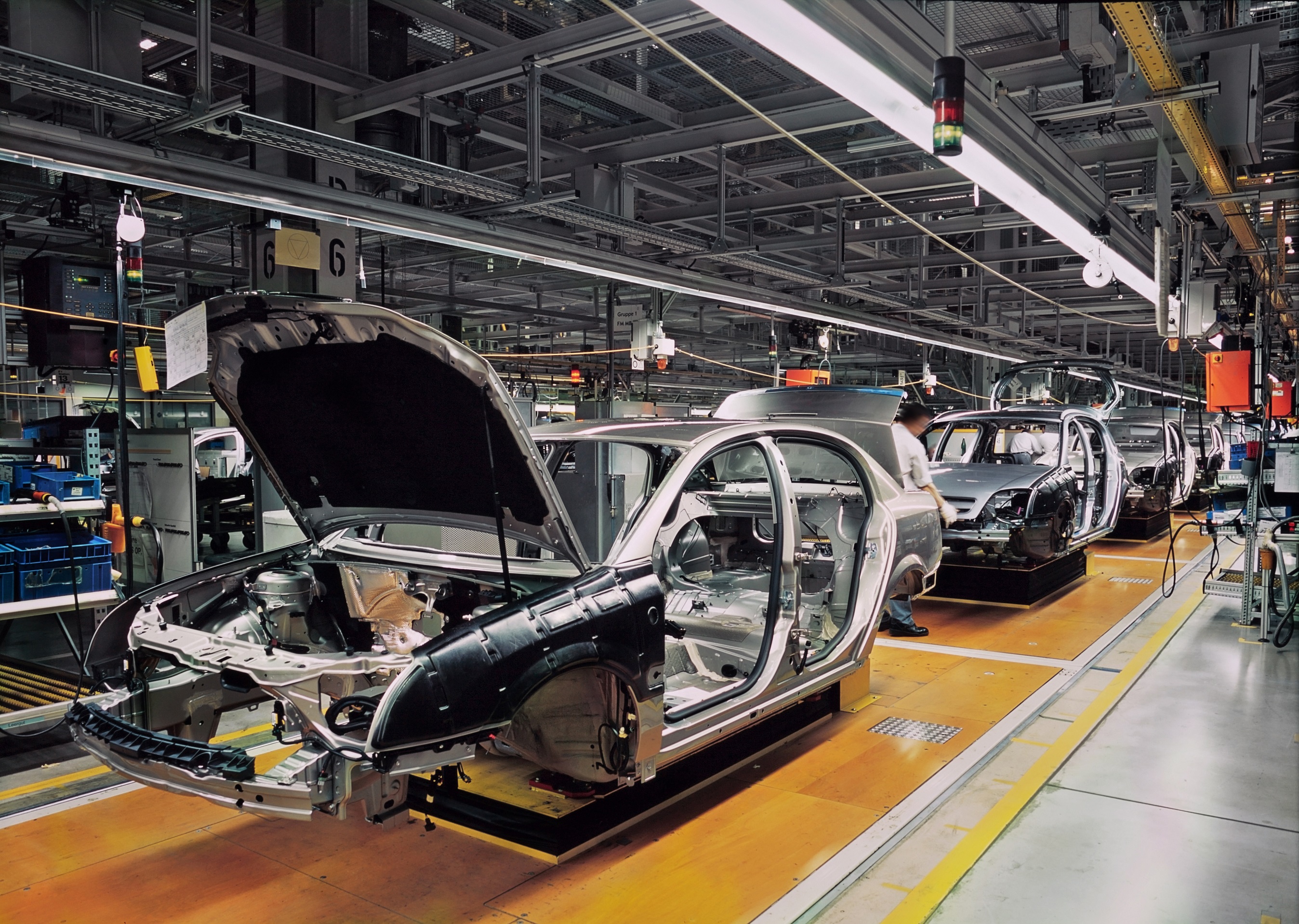 Incomplete cars moving down the production line