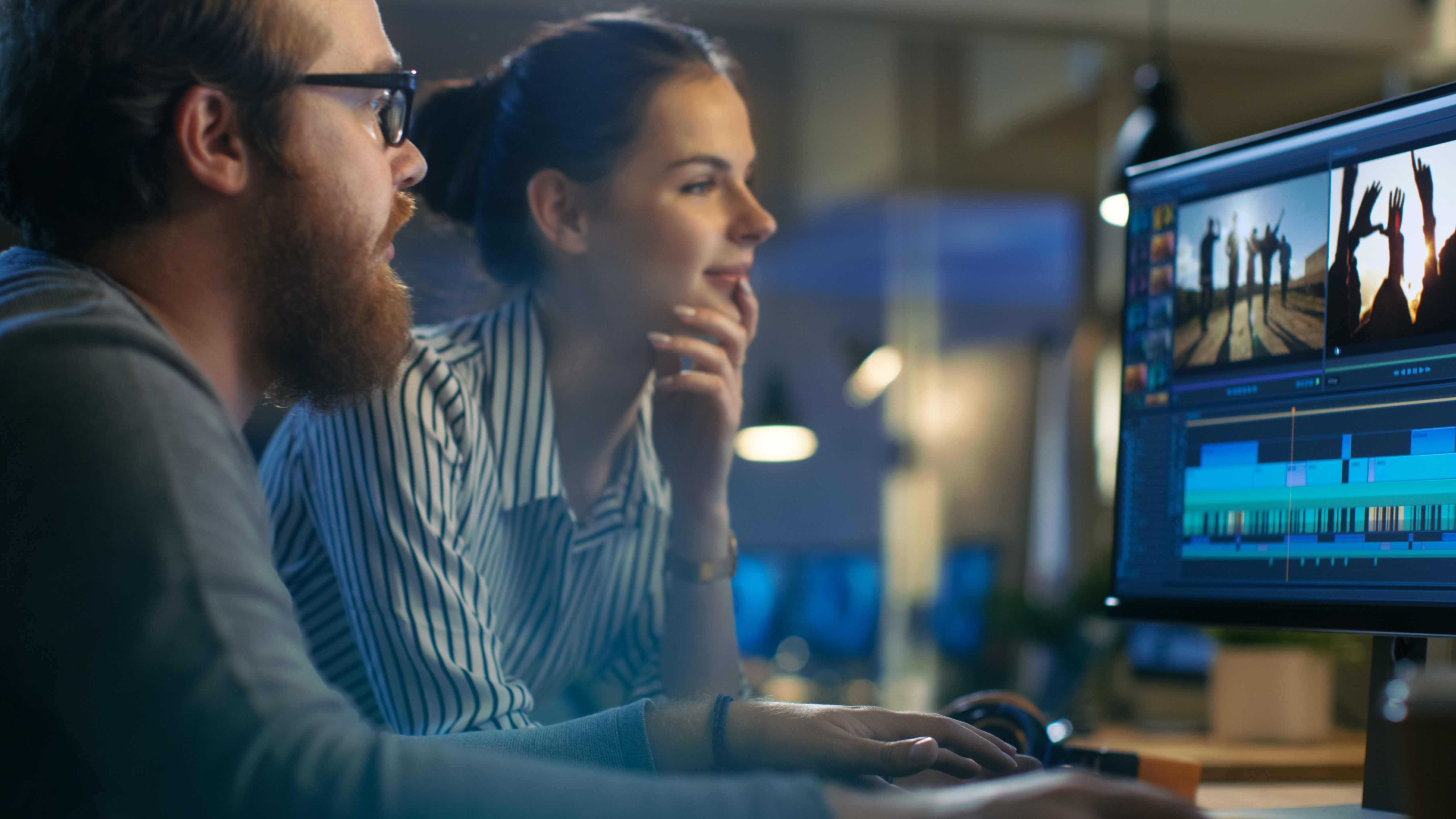 Young media workers collaborate on editing project