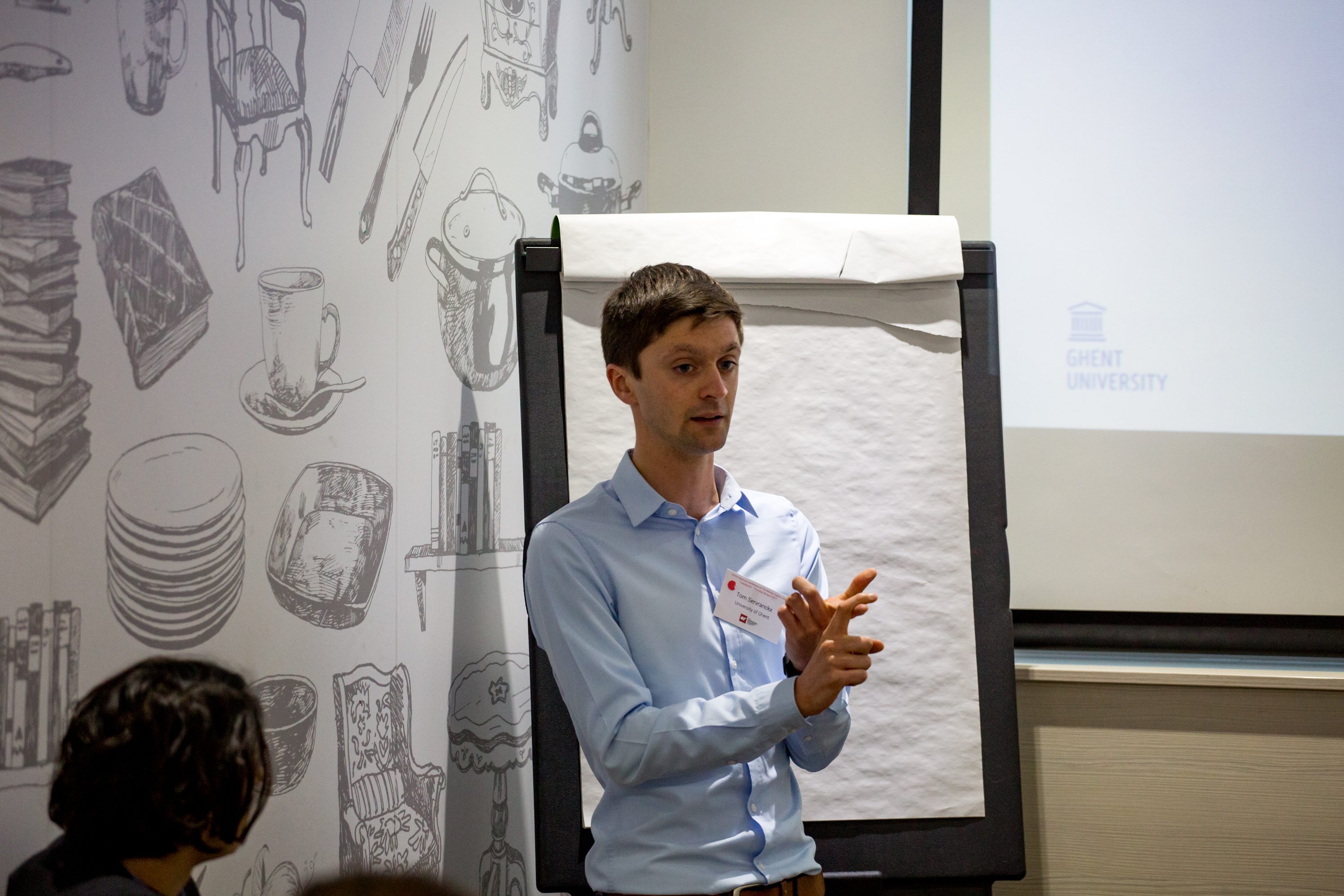 young male presenter with flip chart